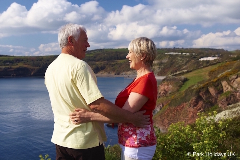 Couple embracing on cliff top